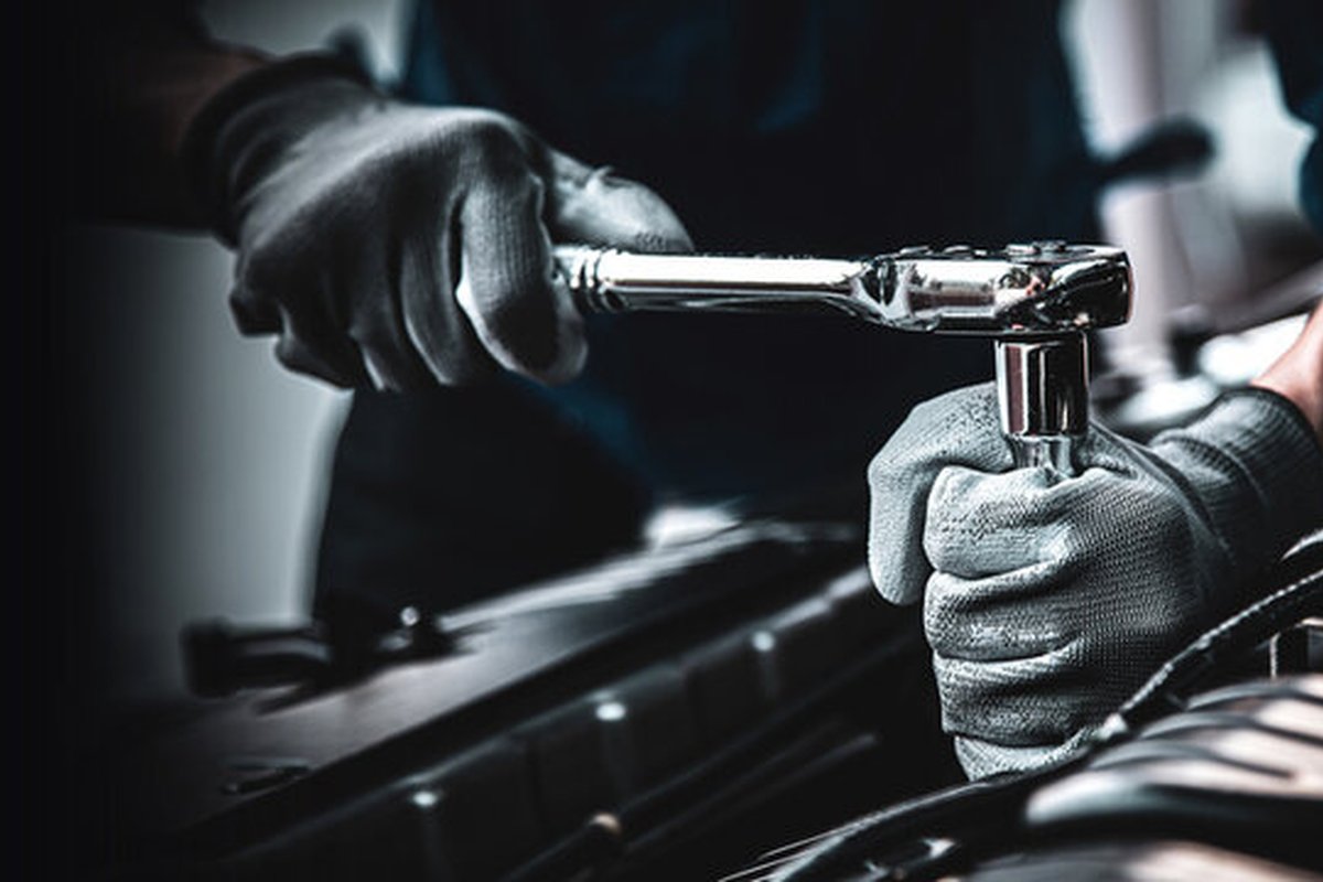 Hands using a wrench